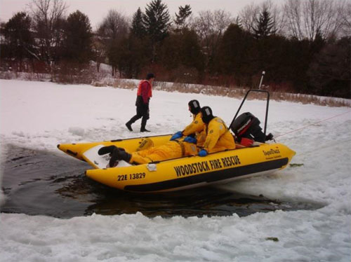 Seawolf inflatable being used for rescue exercise; it's easy to move or carry over obstacles  to get this boat to where you need it to be.